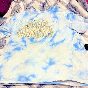It is a kid shirt and in good condition it says grow positive thoughts